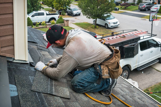 Professional Roofing technician working in Martell, CA